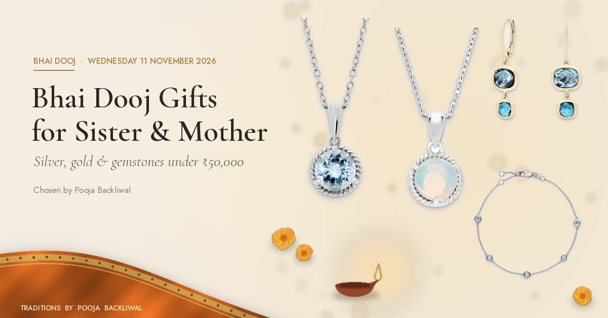 Bhai Dooj gift for sister jewellery: Everyday Aquamarine Rope-Edge Silver Pendant, Everyday Opal Twisted-Frame Silver Pendant, Everyday Graduated Blue Topaz Bezel Drop Earrings and Everyday Bezel-Set Aquamarine Chain Bracelet on warm ivory with saffron silk, marigolds and a diya