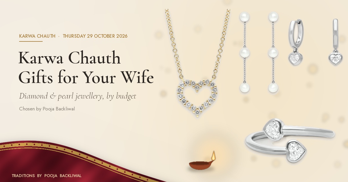 Karwa Chauth gift for wife: Everyday Open Heart Pavé Diamond Necklace, Everyday Three-Pearl Chain Drop Earrings, Everyday Swinging Heart Diamond Huggie Earrings and Contemporary Twin-Heart Open Diamond Ring on warm ivory with red silk and a diya